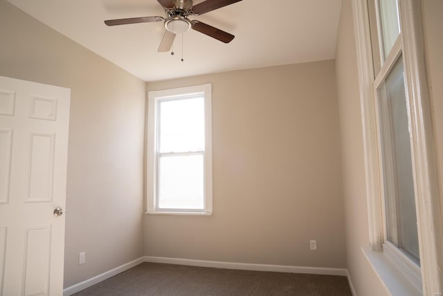 unfurnished room featuring carpet, ceiling fan, and lofted ceiling