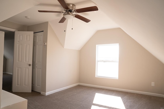 bonus room with carpet flooring, ceiling fan, and vaulted ceiling