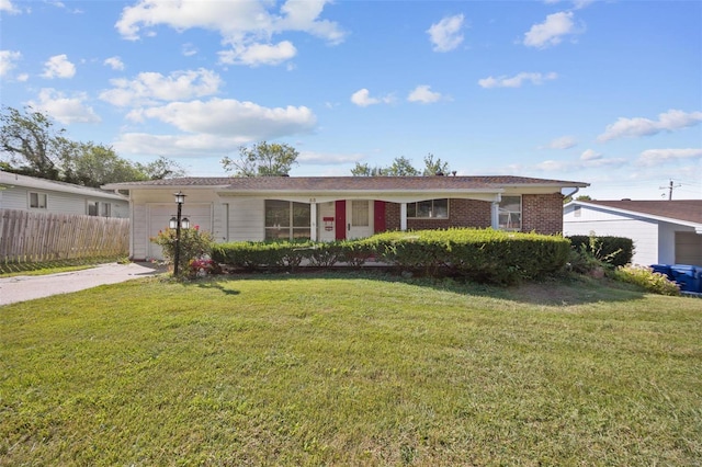 ranch-style home featuring a front yard