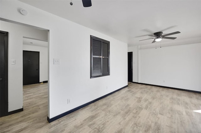 unfurnished room with ceiling fan and light hardwood / wood-style floors