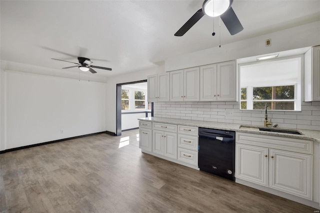 kitchen with white cabinetry, sink, light wood-type flooring, and black dishwasher