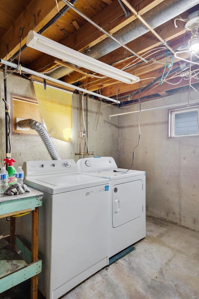 washroom with washing machine and clothes dryer