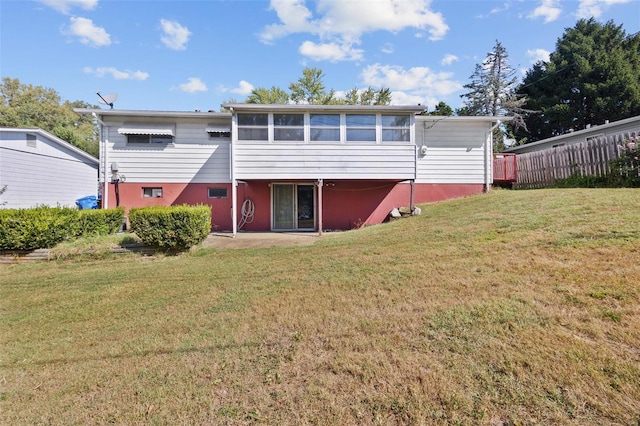 back of house with a yard