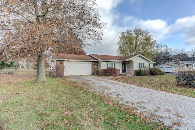 ranch-style home with a front yard and a garage