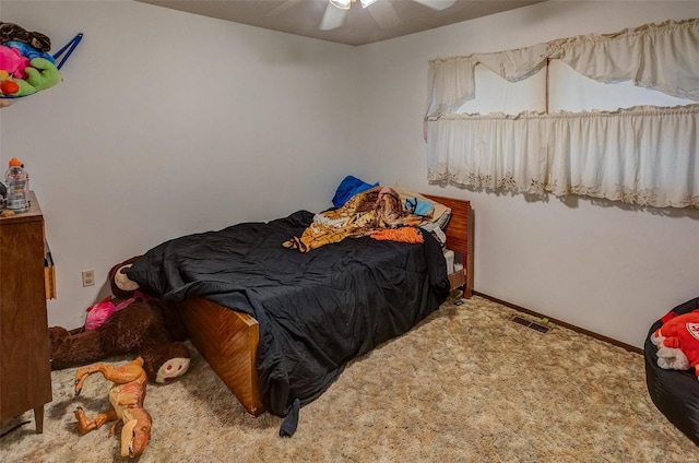 carpeted bedroom with ceiling fan