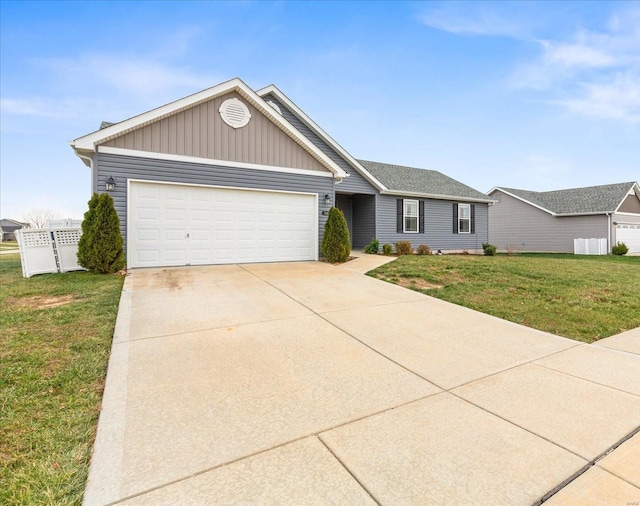 ranch-style home with a front yard and a garage