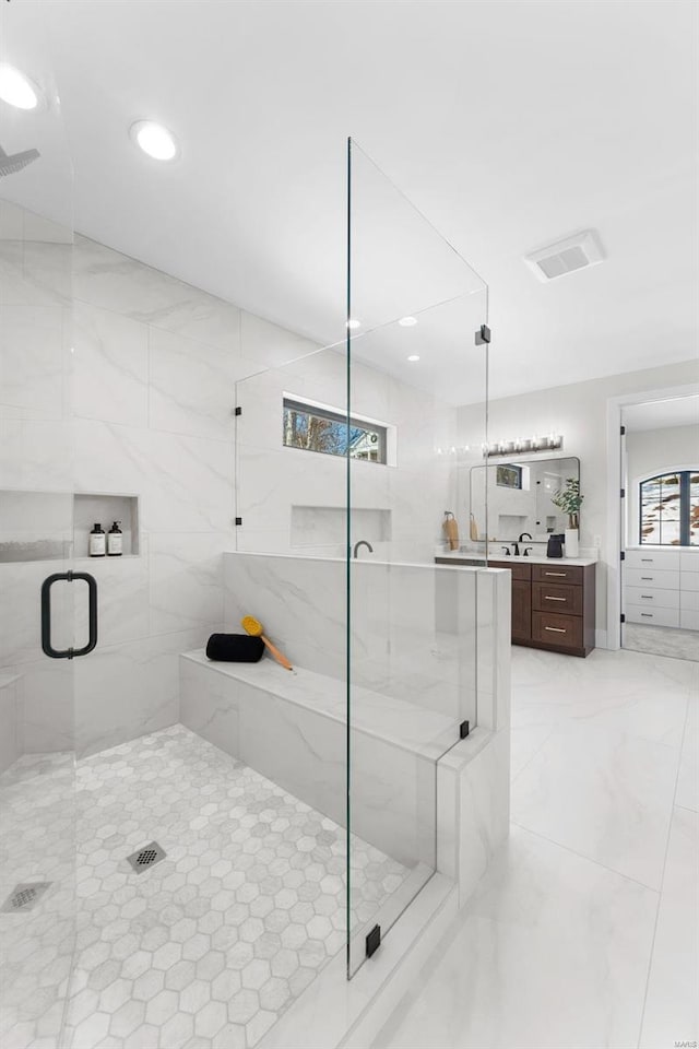 bathroom with vanity and an enclosed shower