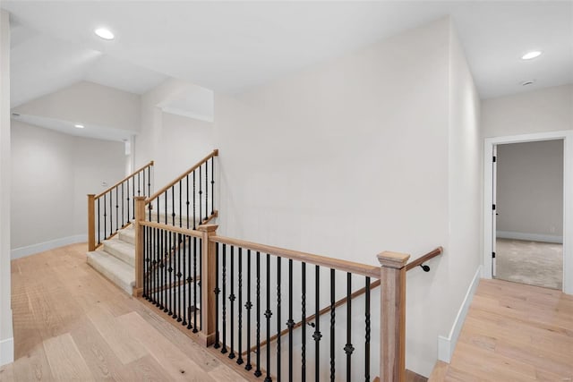 staircase featuring hardwood / wood-style floors