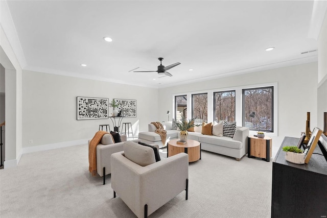 living room featuring crown molding, light carpet, and ceiling fan