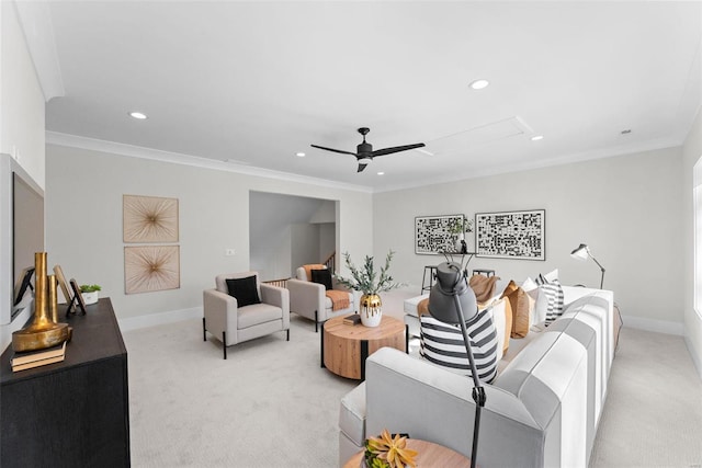 living room featuring crown molding, light carpet, and ceiling fan