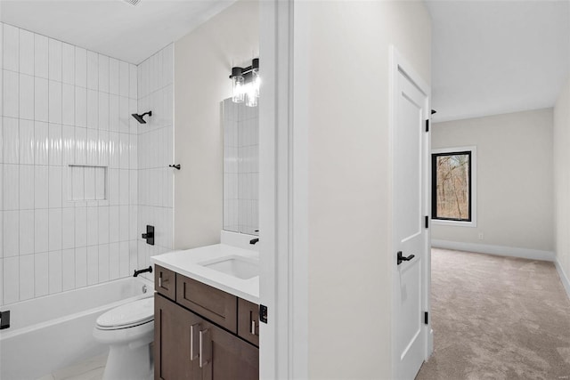 full bathroom with vanity, toilet, and tiled shower / bath