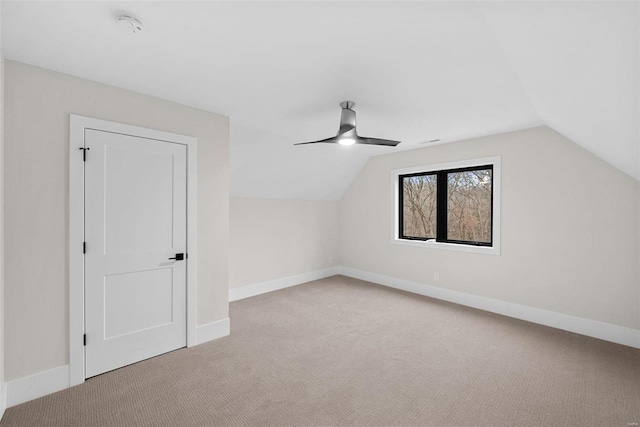 bonus room with ceiling fan, light colored carpet, and lofted ceiling