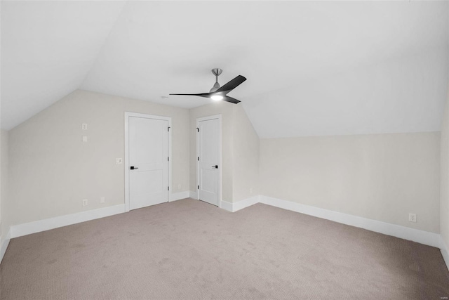 bonus room featuring ceiling fan, carpet flooring, and vaulted ceiling