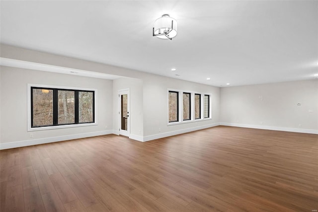 unfurnished living room with hardwood / wood-style flooring