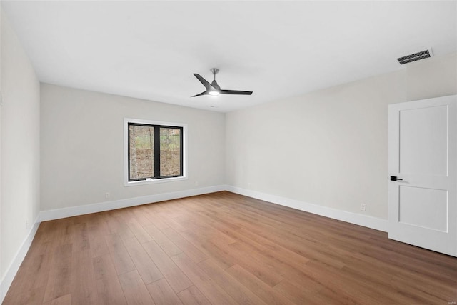 unfurnished room featuring ceiling fan and light wood-type flooring