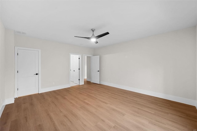 spare room featuring ceiling fan and light wood-type flooring