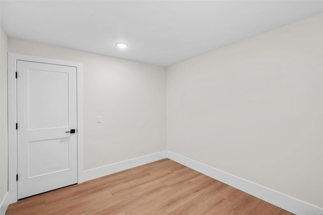 spare room with light hardwood / wood-style flooring