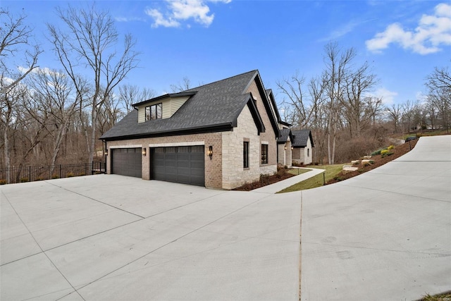 view of side of property with a garage