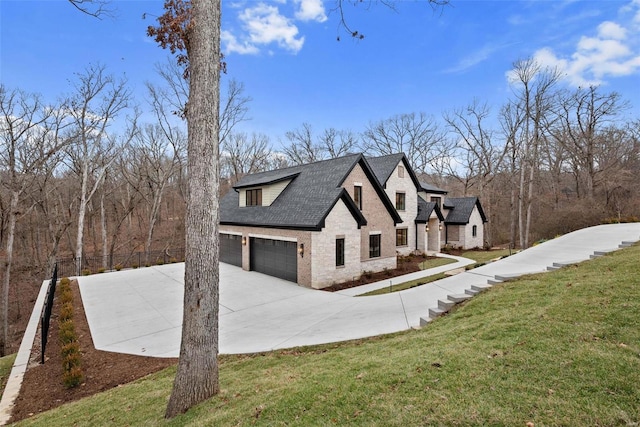 view of home's exterior featuring a garage and a lawn