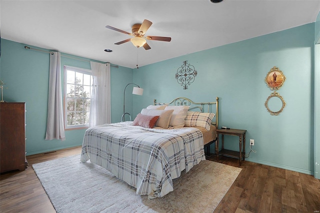 bedroom featuring ceiling fan and hardwood / wood-style floors