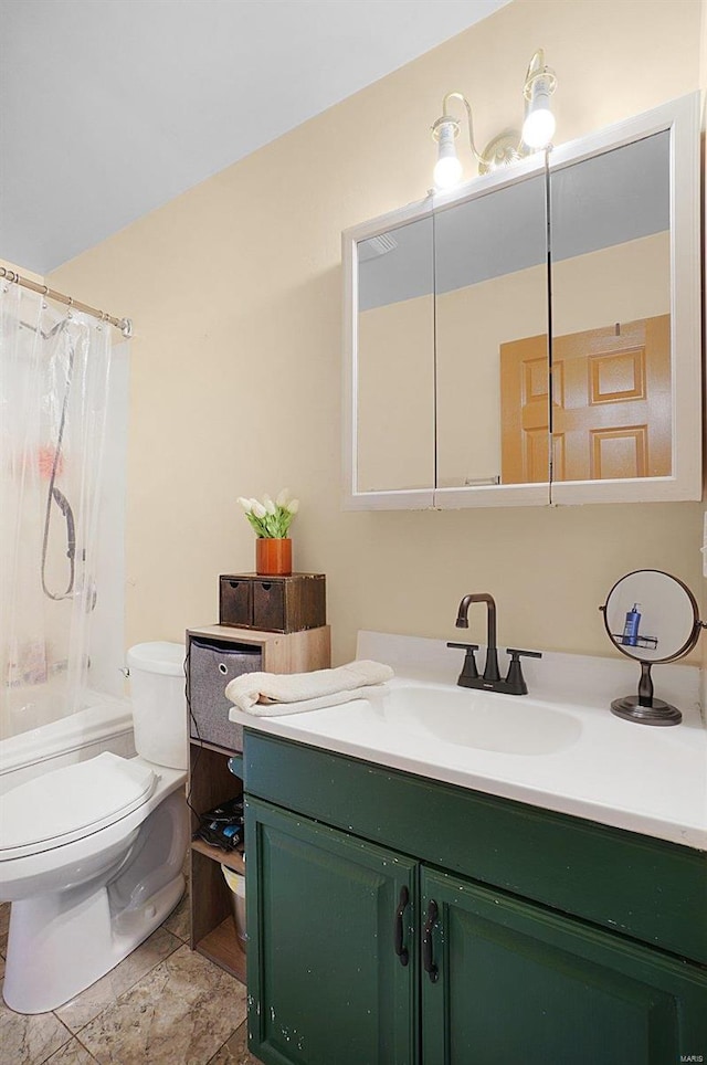 bathroom featuring tile patterned floors, vanity, and toilet