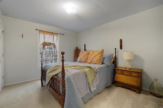 bedroom featuring light colored carpet