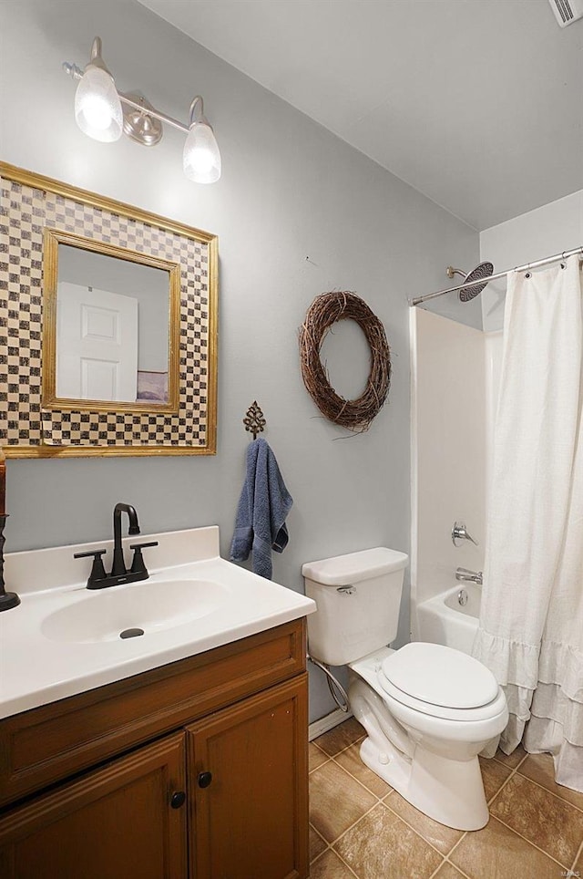 full bathroom with tile patterned flooring, vanity, shower / bath combo, and toilet