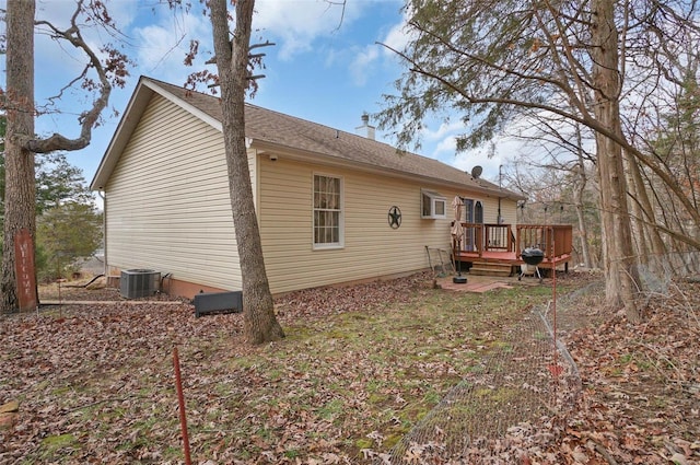 back of property featuring central AC and a deck