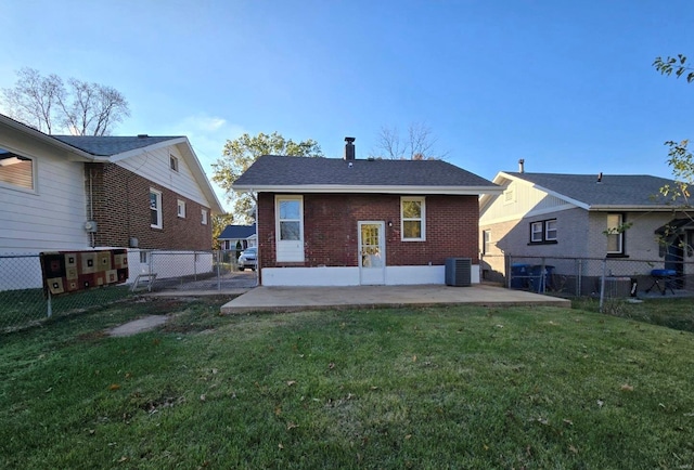 back of house with a lawn, a patio area, and central AC unit