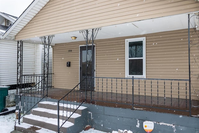 doorway to property featuring a porch