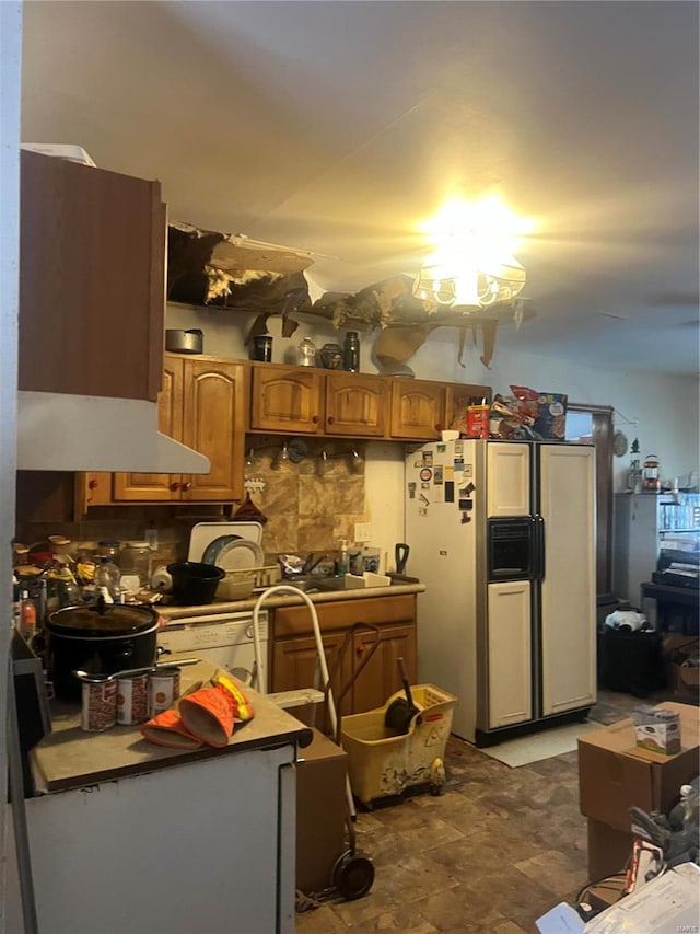 kitchen with white refrigerator with ice dispenser and sink