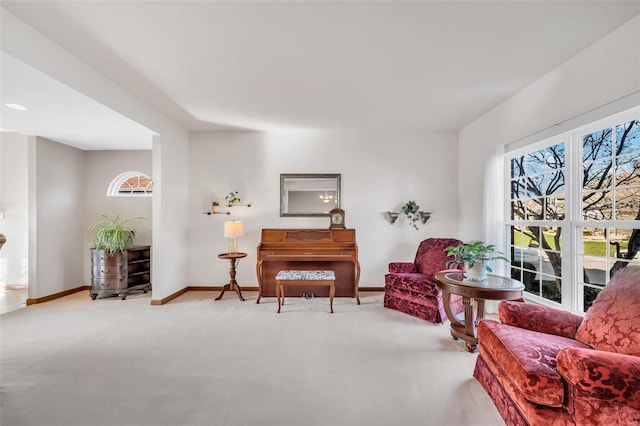 sitting room featuring light colored carpet