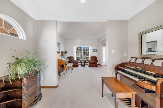 miscellaneous room featuring light carpet