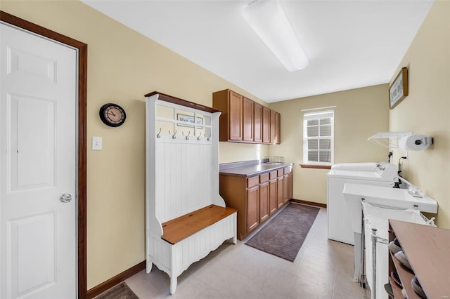 washroom featuring washer and clothes dryer