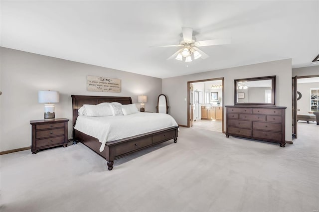 carpeted bedroom with ceiling fan and ensuite bathroom