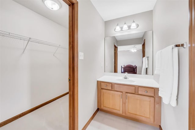 bathroom with vanity and ceiling fan