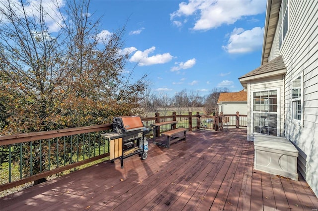 wooden deck with grilling area