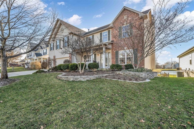 view of front facade featuring a front yard and a garage