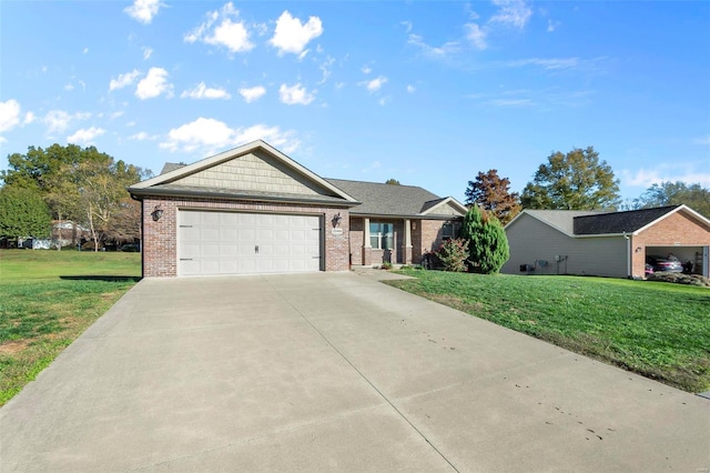 ranch-style home with a garage and a front lawn