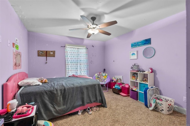 bedroom with ceiling fan and carpet