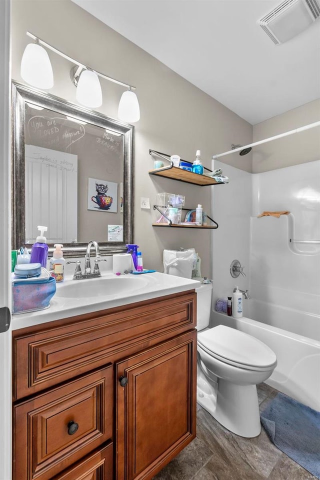 full bathroom featuring vanity, toilet, and shower / bathtub combination