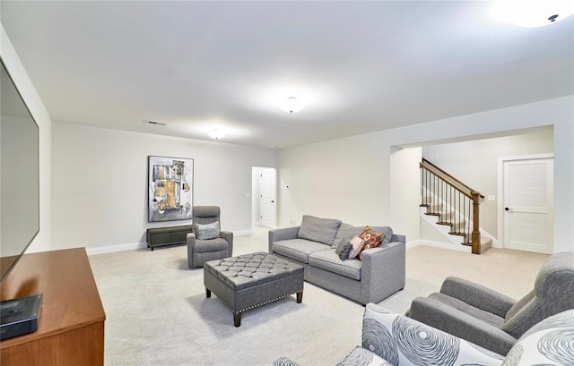 living room featuring light carpet