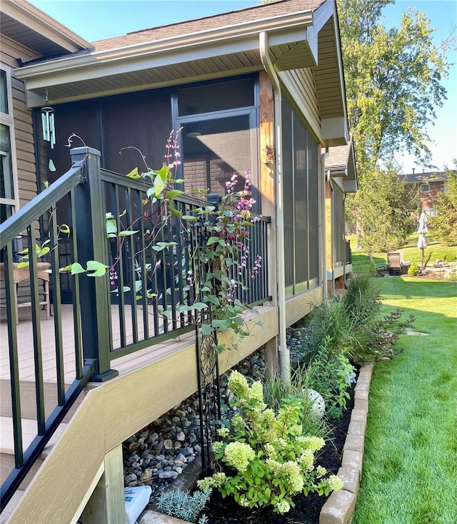 view of side of property with a lawn