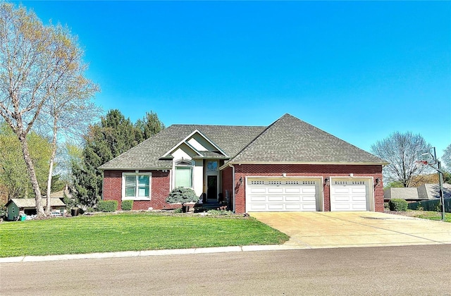 view of front of house with a garage and a front yard