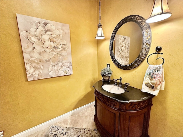 bathroom featuring tile patterned flooring and vanity