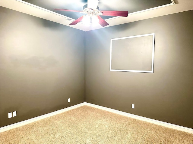 empty room featuring carpet and ceiling fan