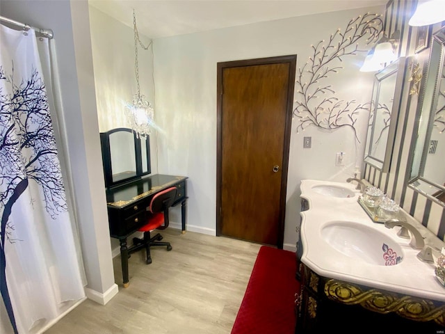 bathroom featuring vanity, curtained shower, and wood-type flooring