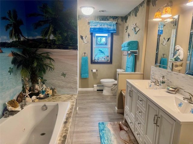 bathroom with a baseboard radiator, a relaxing tiled tub, wood-type flooring, toilet, and vanity