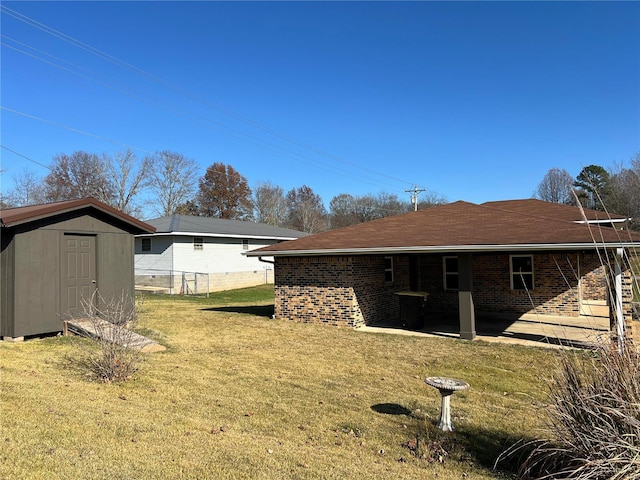 view of yard with a patio and a shed