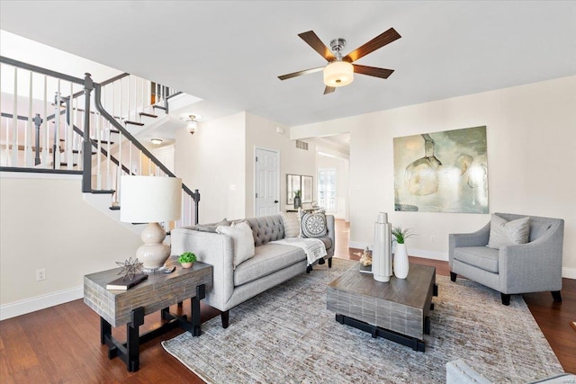 living room featuring hardwood / wood-style flooring and ceiling fan